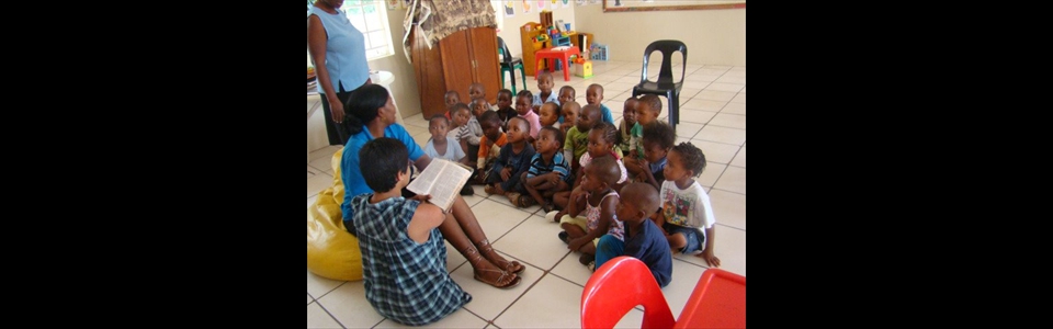 Reading Bible Stories to the children at St. Peter Daycenter in Botswana Africa 2012